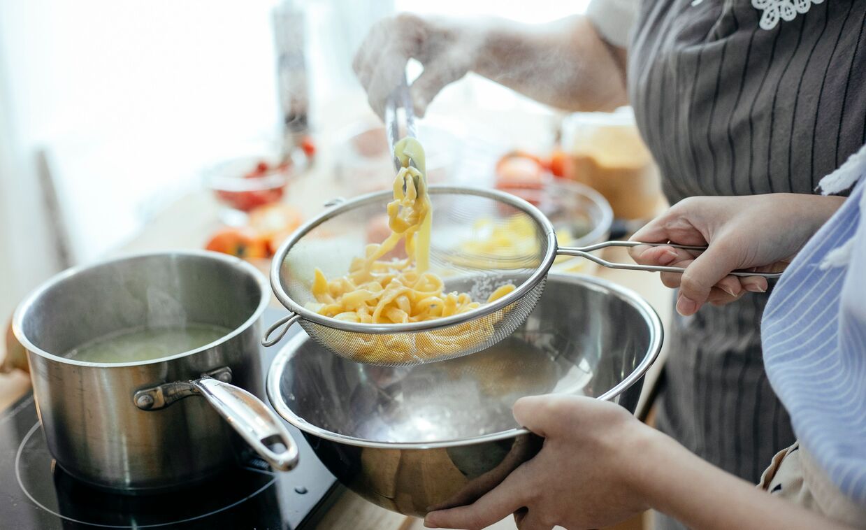 SnapStrainer clip-on silicone pot and pasta strainer in a kitchen setting
